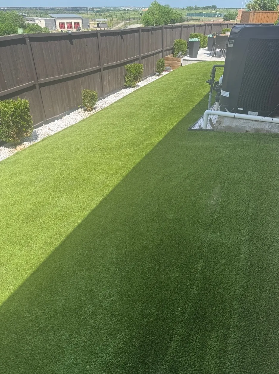 Well-maintained artificial turf side yard pet run after professional sanitization